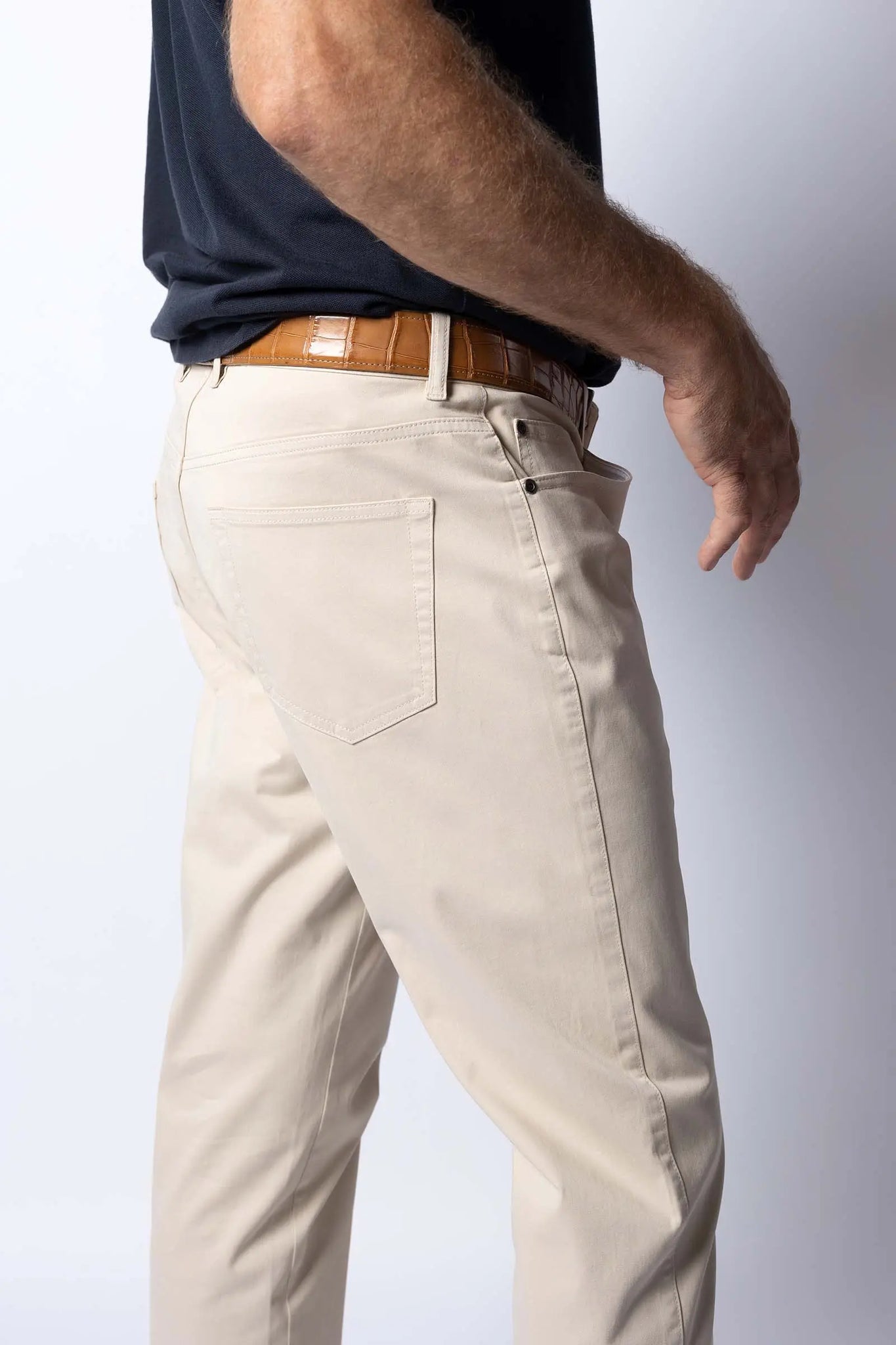 Light stone colored five pocket pants showing great fit with stretch supreme cotton and microfiber cleaning pockets