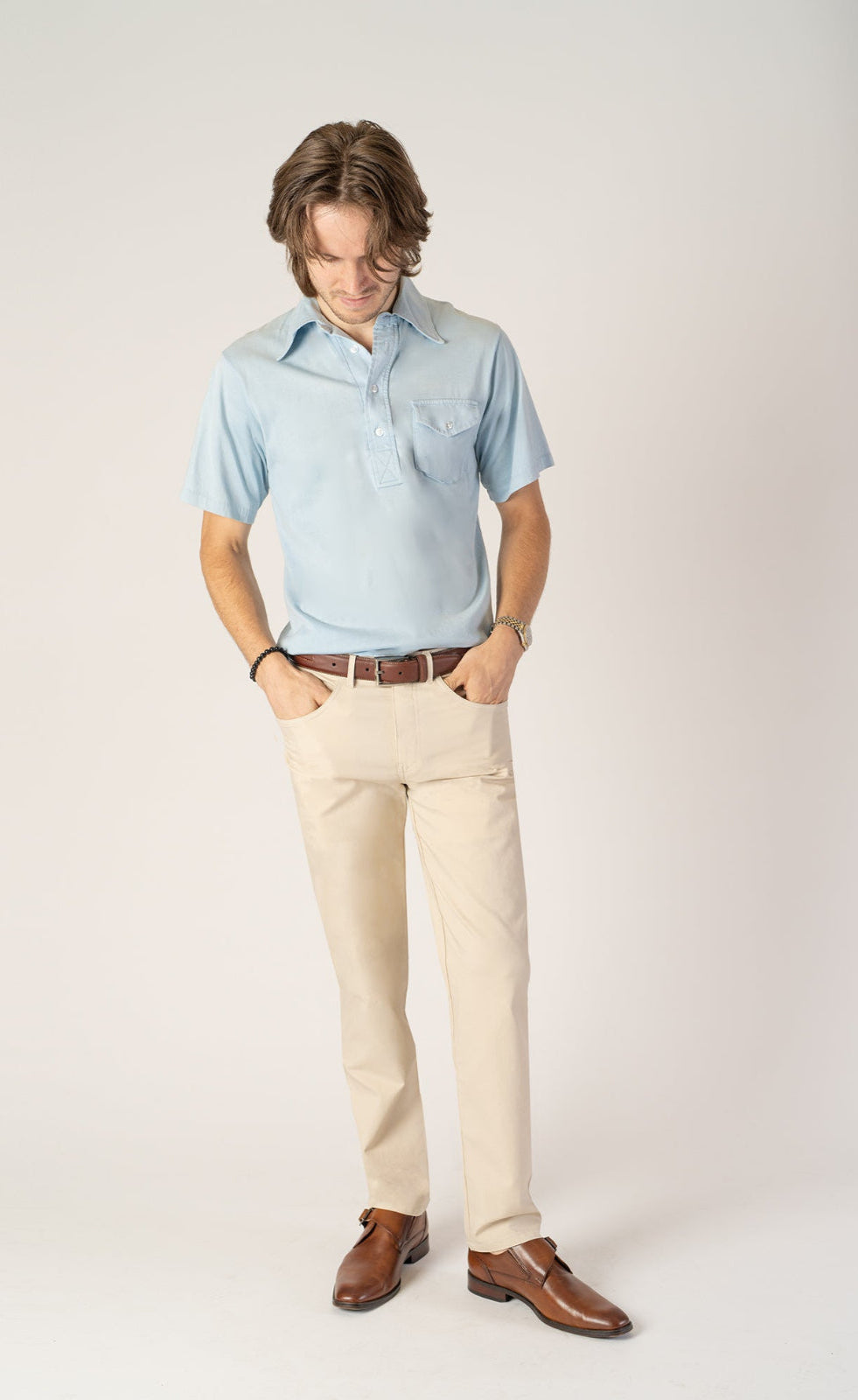 Man wearing stone New Found Thread pants
