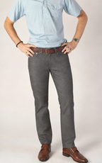 Front view of man wearing gray Fletch performance 5-pocket pants with a light blue shirt